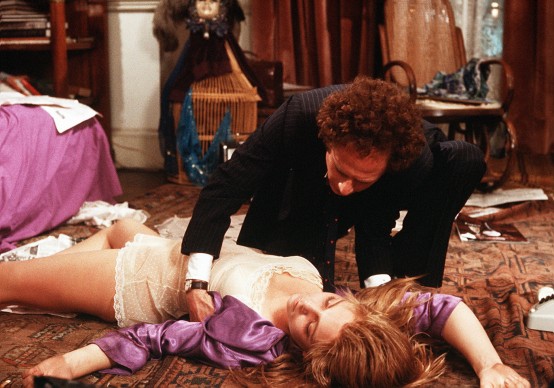MILENA FLAHERTY (TERESA RUSSELL) LIES ON THE BED AFTER HER SUICIDE ATTEMPT AS ALEX LINDEN (ART GARFUNKEL) STRUGGLES WITH HER *** Local Caption *** Feature Film